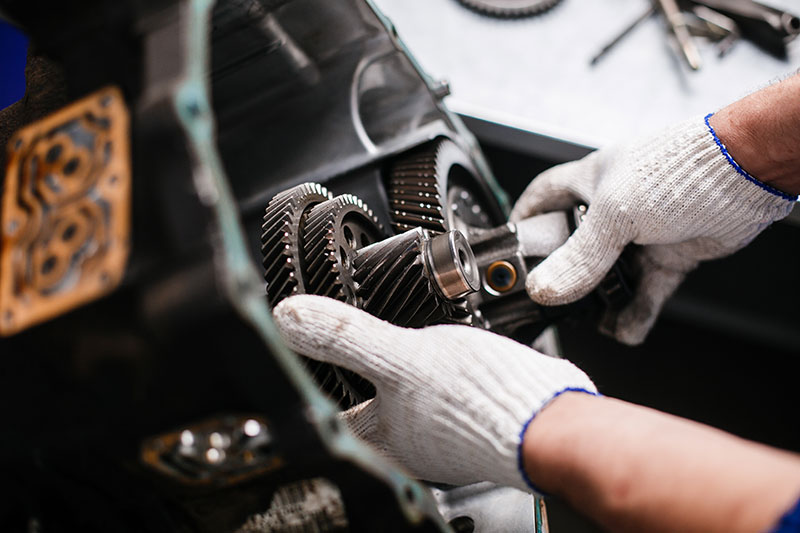 Mechanic Fixing Automatic Car Transmission